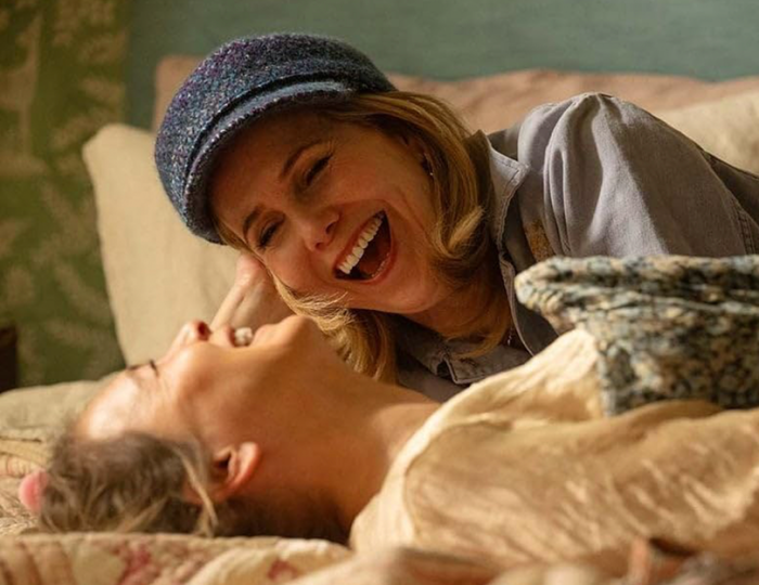 Bridget Jones laughing with friend Shazza. Scene from new film "Mad about the boy".