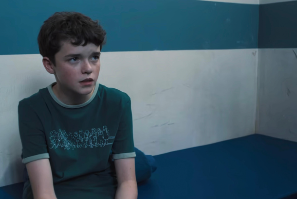 Scene from Adolescence where 13-year-old Jamie is in a prison cell.