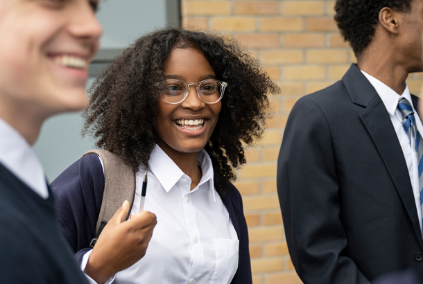 A 16-year-old at school chatting with her friends